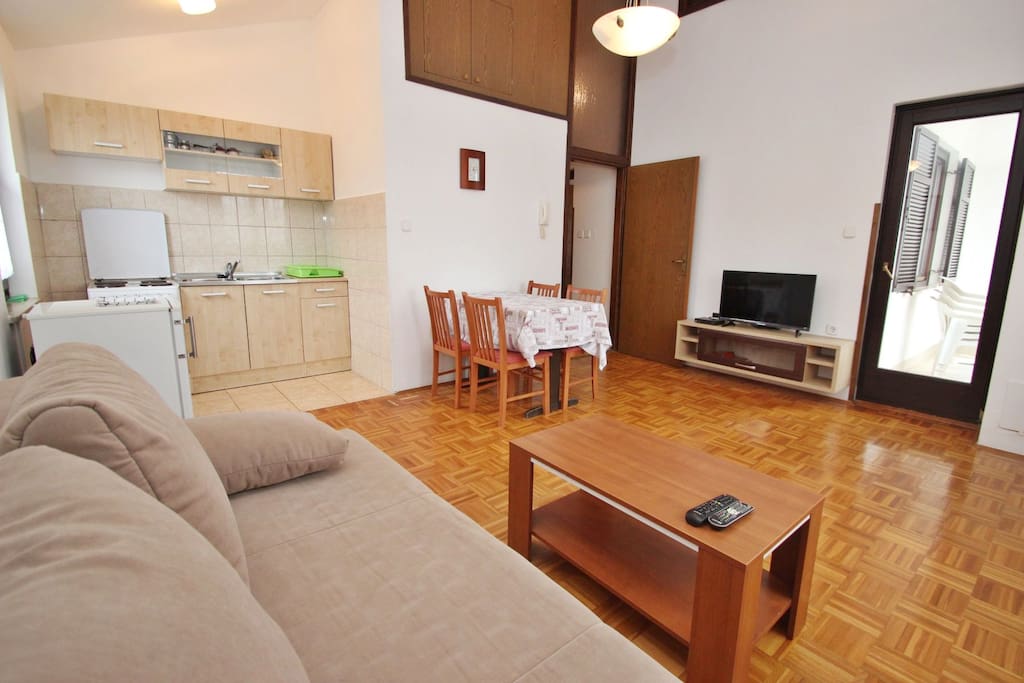 Spacious living room with dinning area and kitchen.