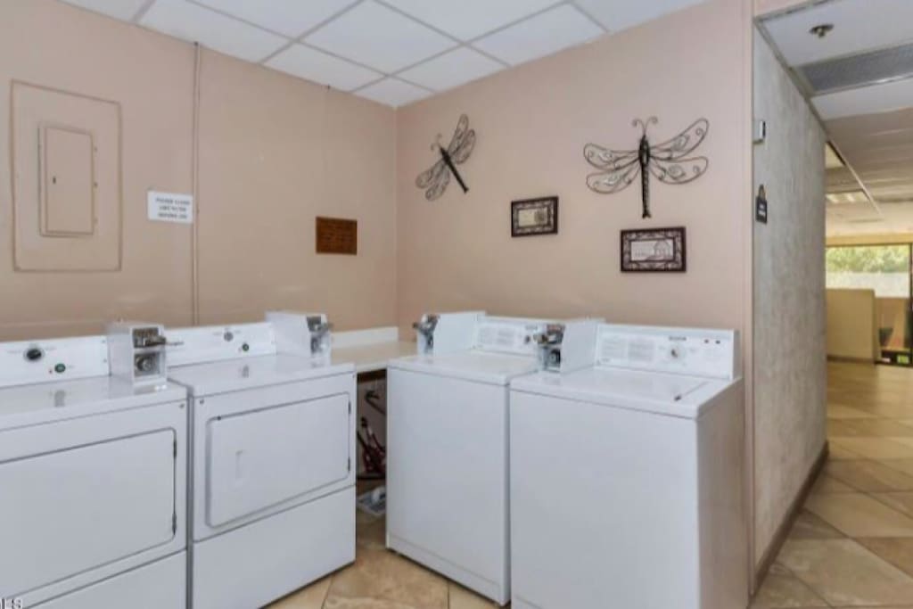 Community coin-operated laundry room available 24 hours per day