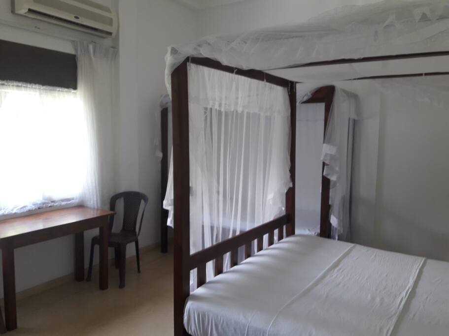 The bedroom showing double and single beds