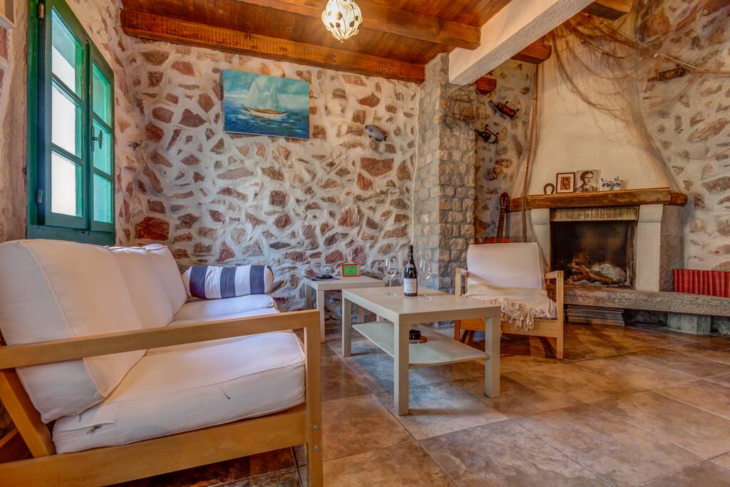Living room with fireplace will make you forget time of year.