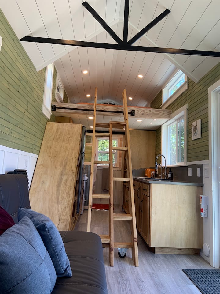 A custom built alternating tread ship ladder allows easy access to the sleeping loft, but it does take some getting used to.