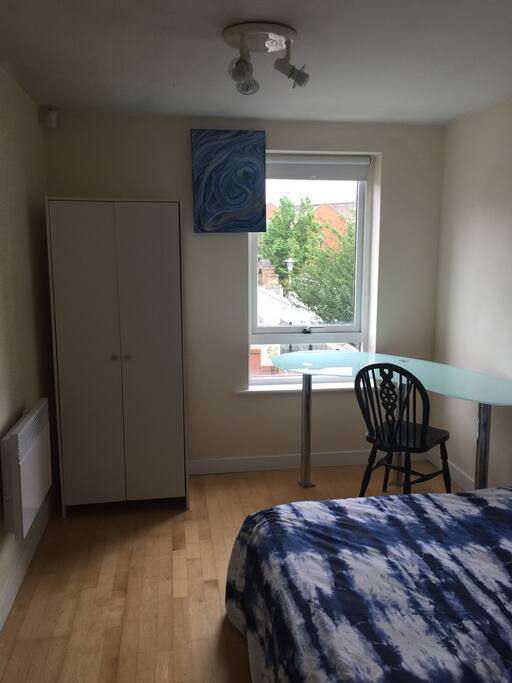 Second bedroom with desk and wardrobe