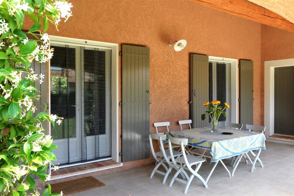 Shaded front terrace for dining or relaxing