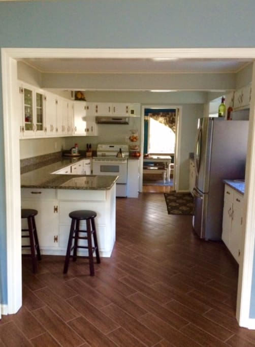 Renovated kitchen with bar stools