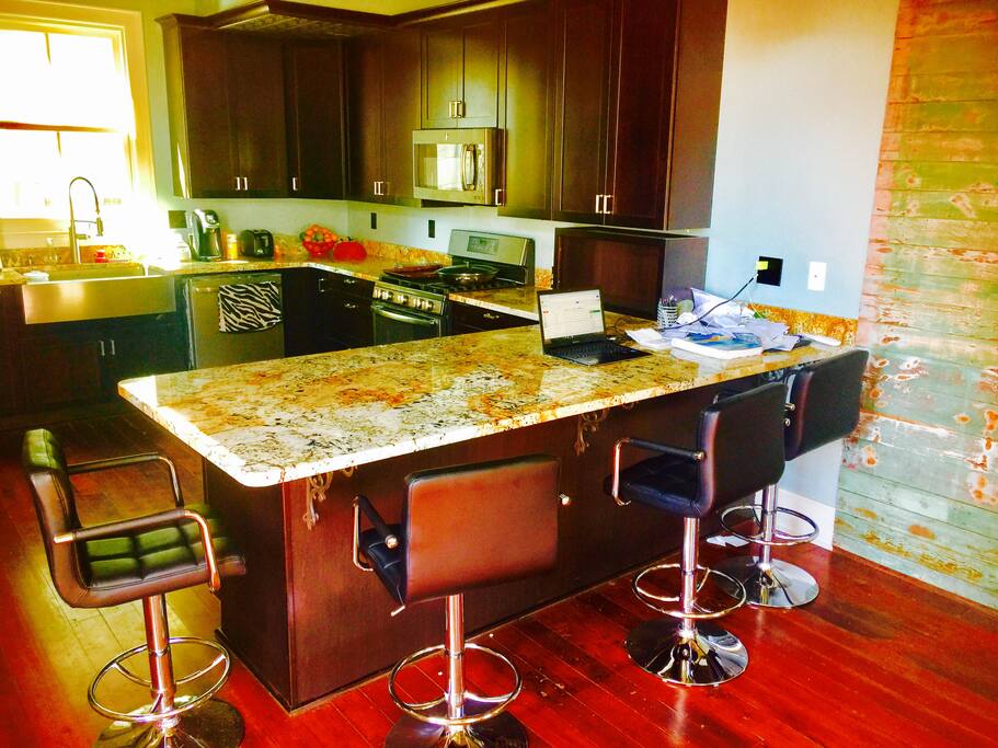 Sit around a magnificently large granite countertop!