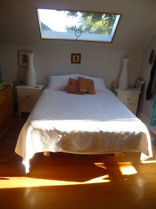 Master bedroom with queen sized bed and private balcony
