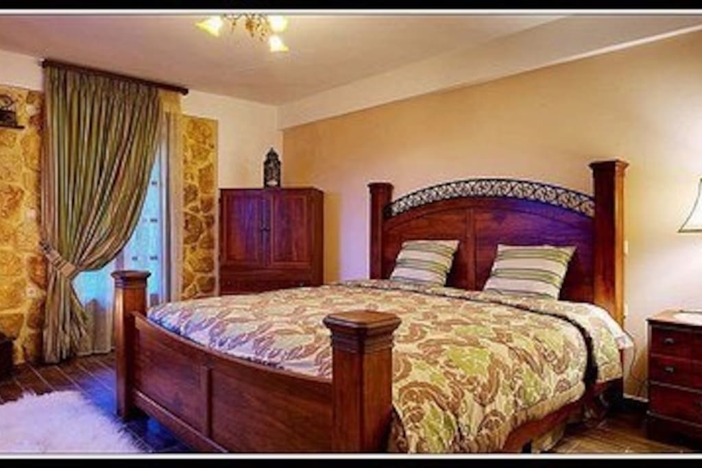 The master bedroom of "Kanaki" with the king size bed, on the first floor.