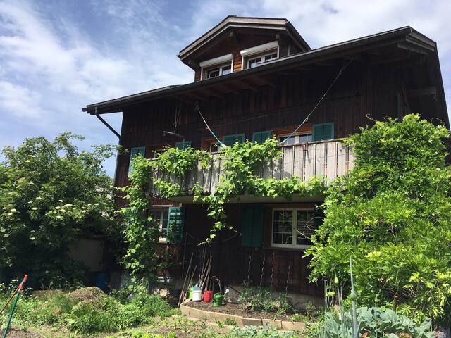old farmhouse overlooking the Glarus Alps