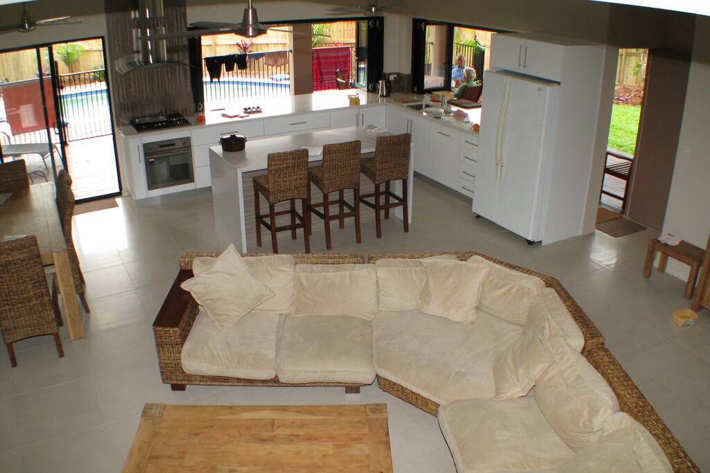 Open plan living areas flowing out onto rear deck and pool