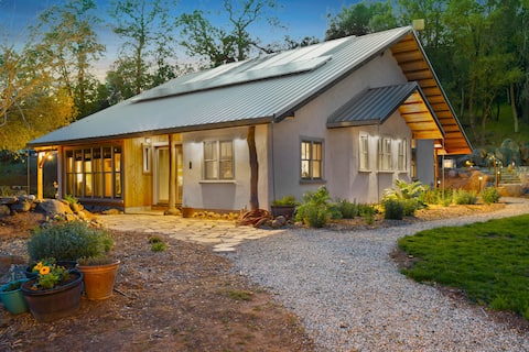 Sonora Eco-Friendly Straw Bale House on pond