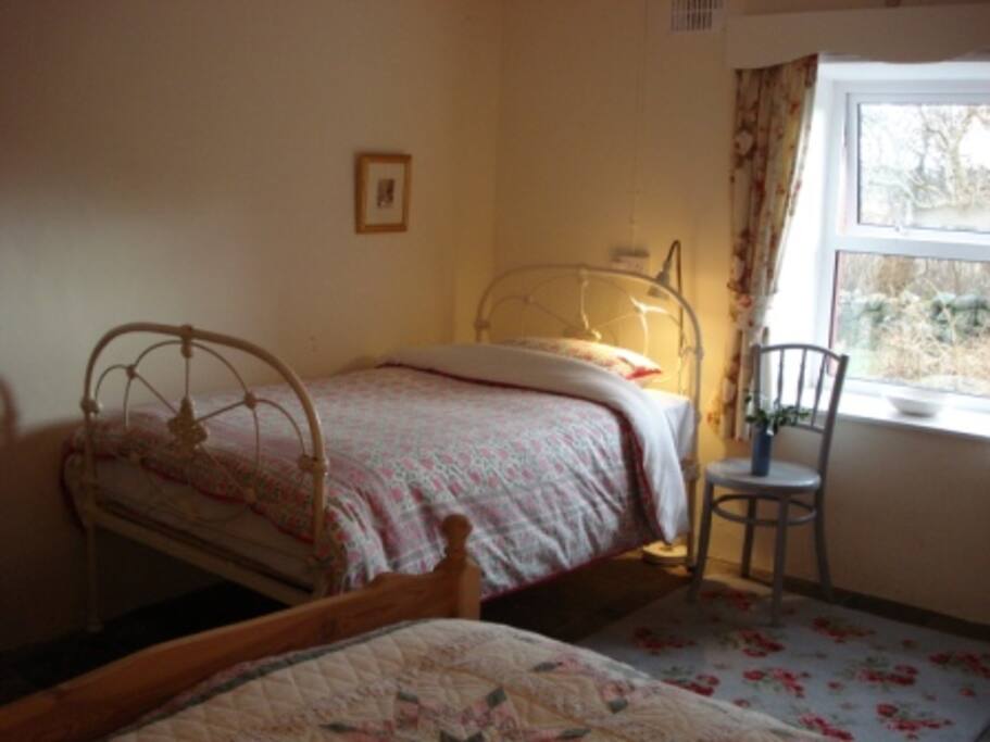 bedroom with a double and single bed