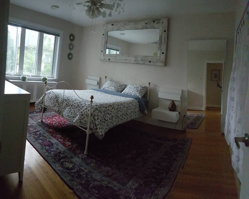 Master Bedroom w/ dresser and closet.