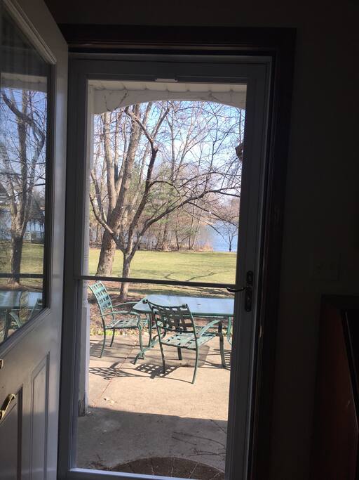 Small private patio area with table and chairs adjacent to guest entrance