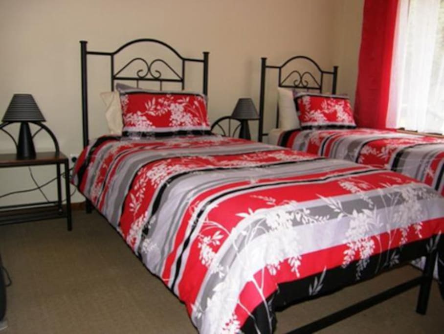 2 single beds in second bedroom