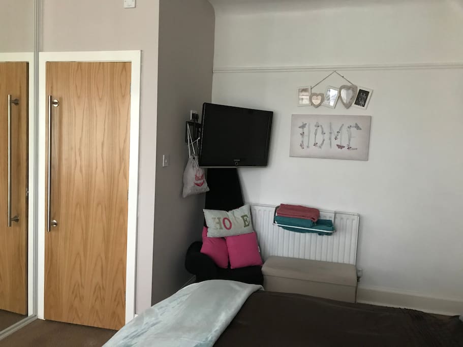 The TV area and ensuite door