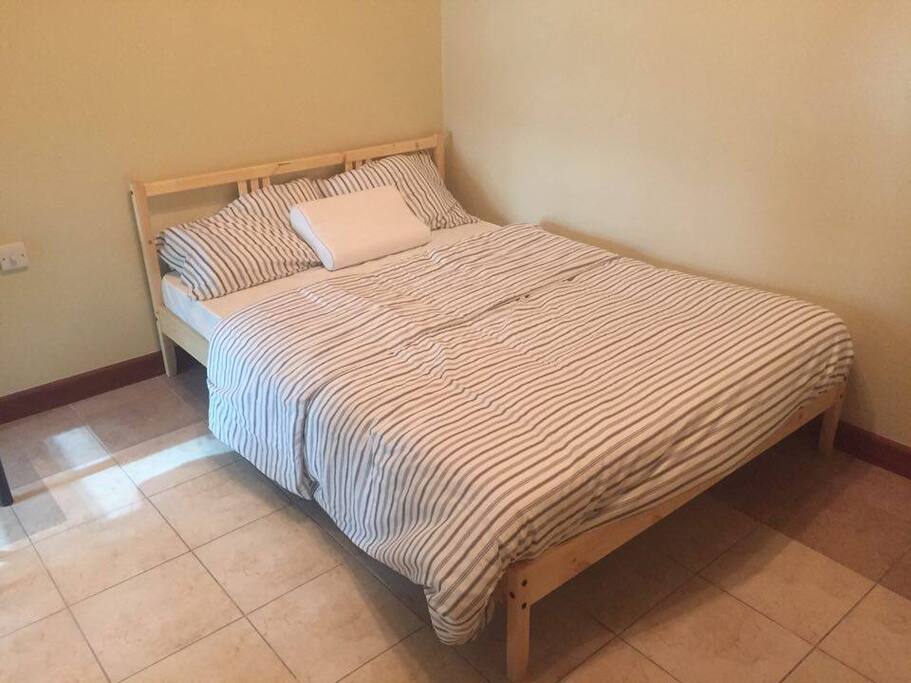 Your room with a queen size bed