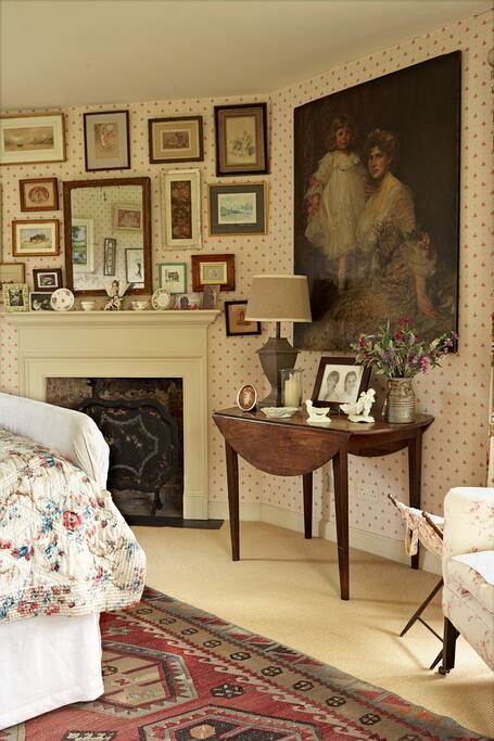 Main bedroom. Fireplace now houses a wood-burner