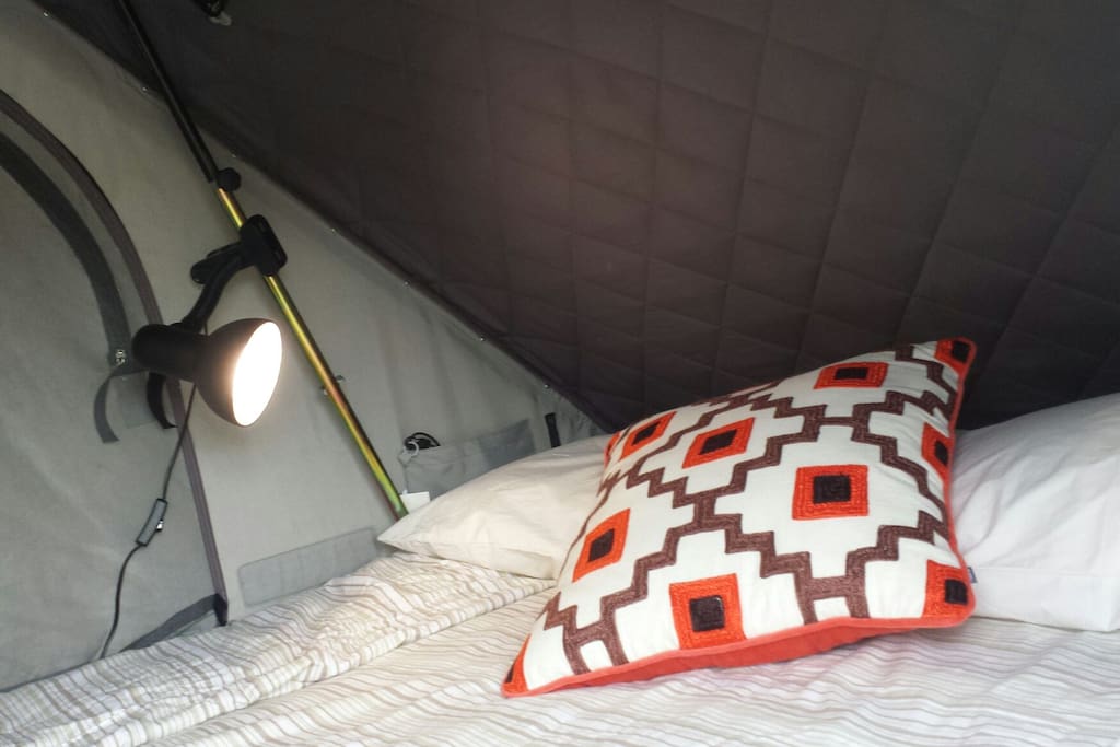 Its the same size as a double bed, fitted with a very comfortable mattress, similar to a futon.