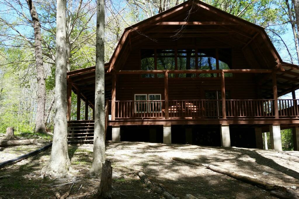 Gorgeous picture window for tree top views and 3 wrap around porches to sit on.