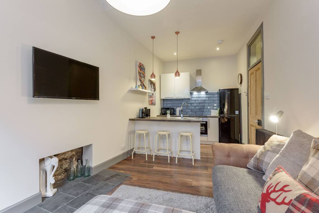 Come home to a large sofa and wide-screen TV equipped with cable & Netflix after a long day of exploring the city.