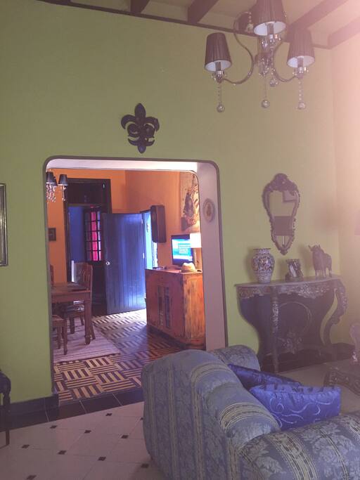VIEWS OF LIVING ROOM AND PARTIAL DINING ROOM