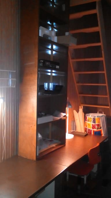 Half room with stairs of gallery.