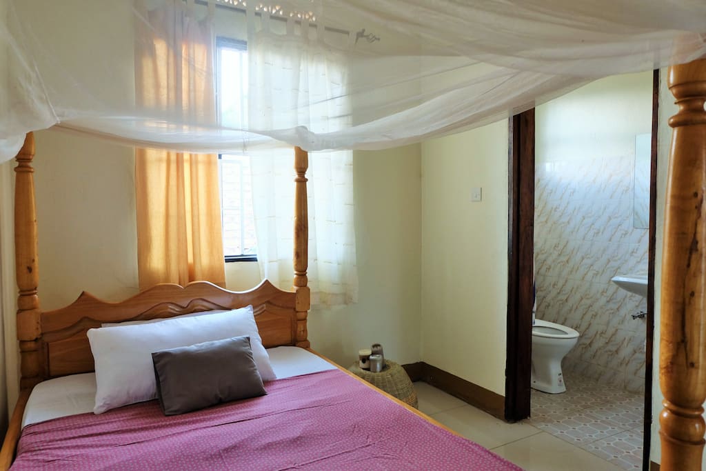 Bedroom with private bathroom and shower