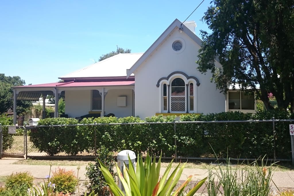 Large country home only 200m from city CBD and a block from railway station.