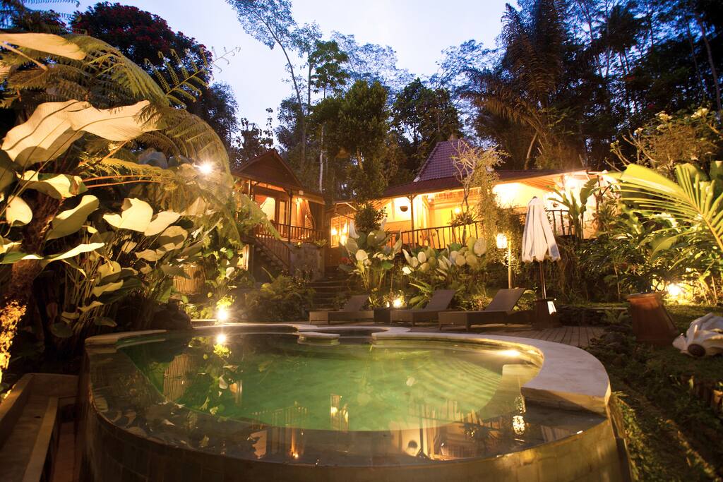 the evening view of pool and the entire villa