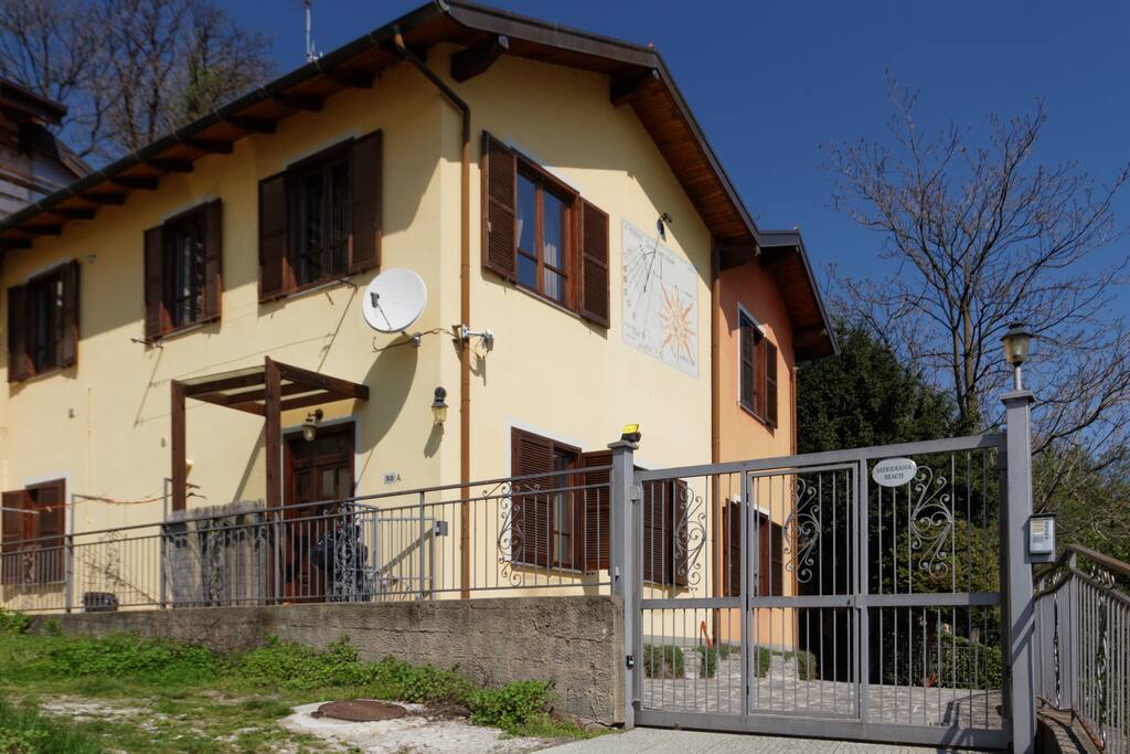 the gate, the house is the orange one