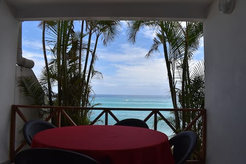 Studio vue mer et pieds dans l'eau