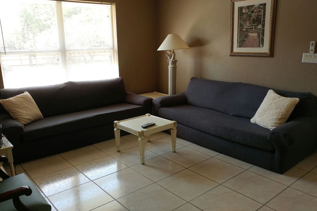 Current living area layout with new soft slip covered sofas. Truly great for sleeping.