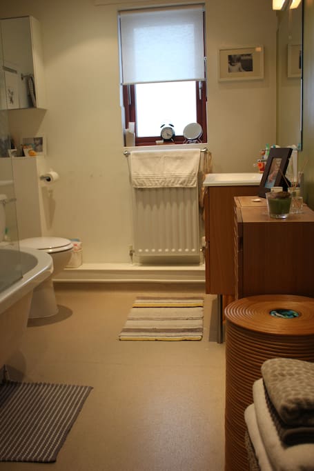 Bathroom with bath and shower