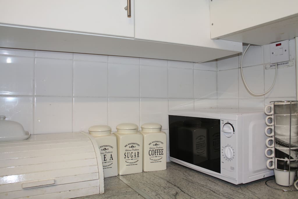 Kitchen with microwave and oven