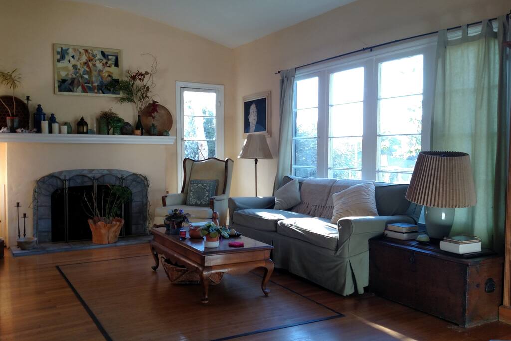 Living Room w/ tons of light and decorative fireplace