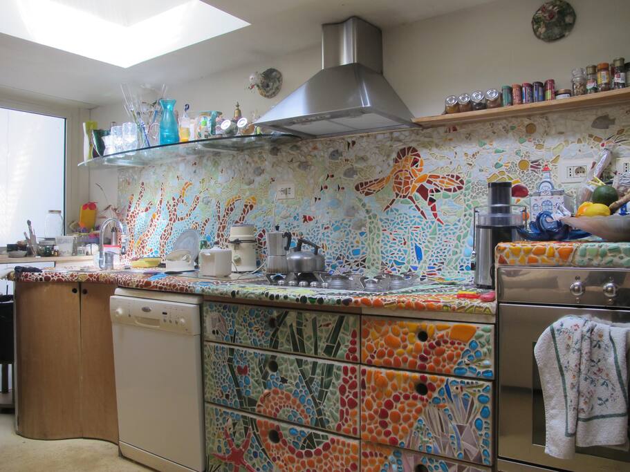 Colored kitchen, with dishes, frigo.