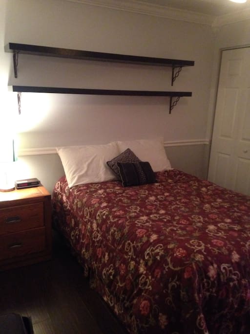 Spacious bedroom with nightstand and dresser