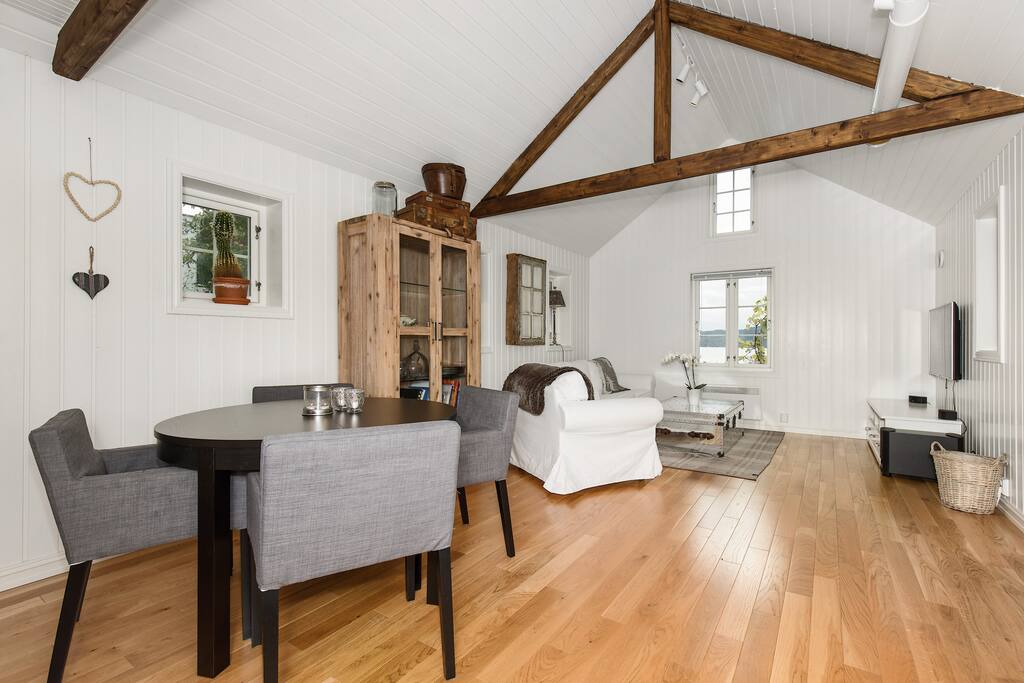 Livingroom with heated floor and stunning fjordview.