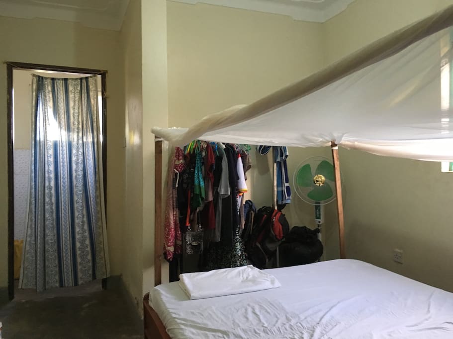 Fan and hanging space for clothes.