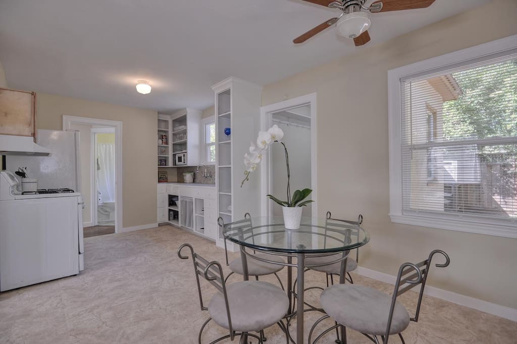 Dining area and kitchen are incredibly spacious and feature light-filled large bay windows.