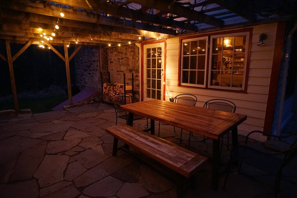 The patio at night. A table for six is ready for all of your al fresco meals.