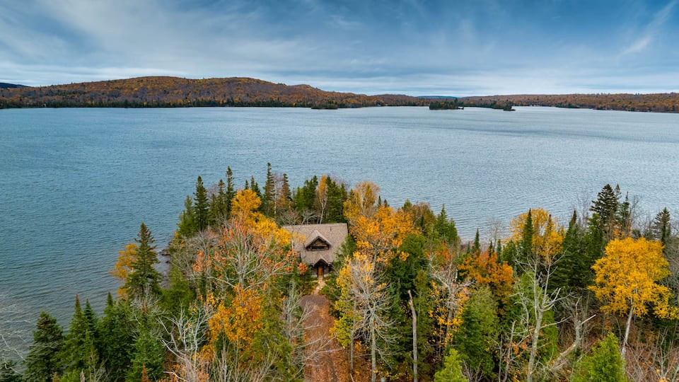 A stone-and-bark cabin on Lake Medora, Eagle Harbor Township, Michigan, United States, photo 3 of 10