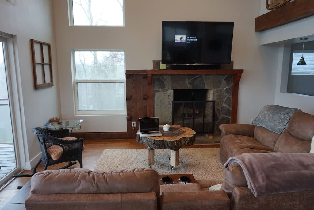 Living room with 65 inch TV, Apple TV & Maple Trunk coffee table (with wheels)