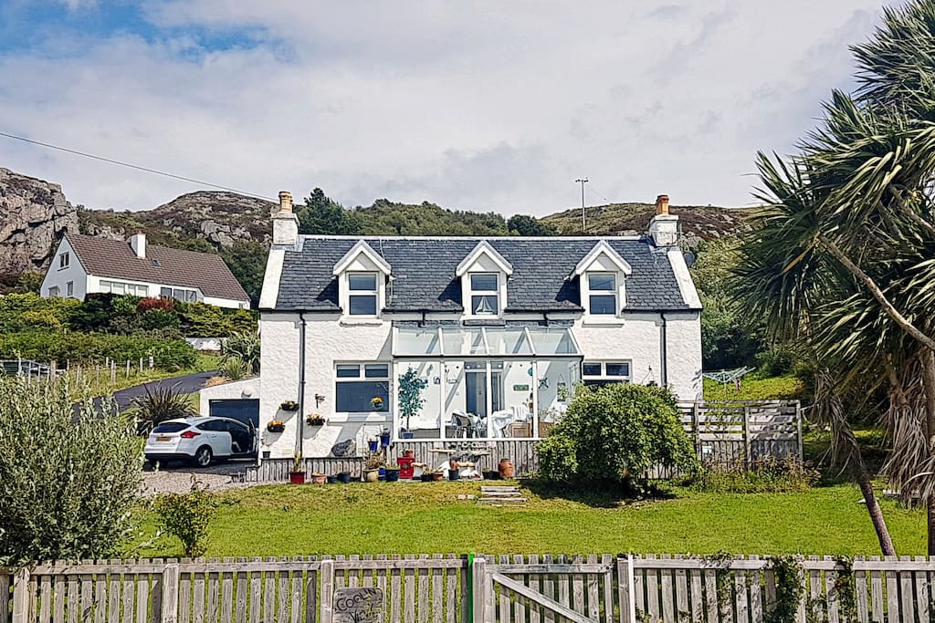 The house and conservatory. Every window is forward-facing and when you first see the views you will understand why. Almost 180 degrees of stunning Highland scenery.