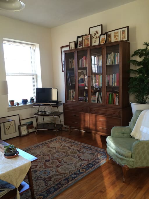 Living room with a portable TV that includes antennae and HDMI cable. No cable access.