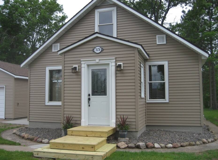 Welcome to your home away from home! This retreat backs up to Crooked Lake Park and is also just 2 blocks from town...just across the street to mini golf, movie theater, coffee shop, restaurants, pubs, laundromat, Dairy Queen, Subway, stores/shops, Gandy Dancer Trail (ATV's, Snowmobililing, biking and hiking from town to town) and more!
