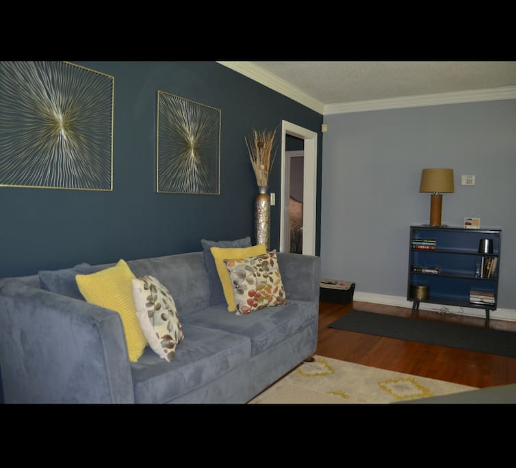 Living room to sit, relax & talk. Couch also has a pull out bed already made to rest.
