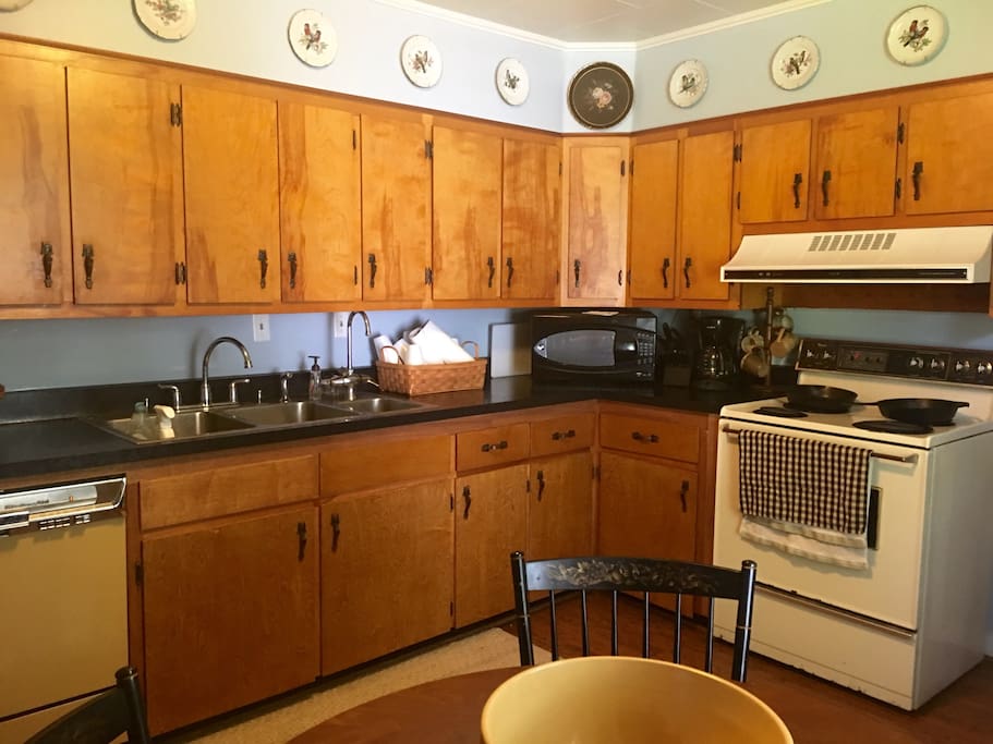 Fully stocked kitchen! Oven, stove, microwave, toaster oven, coffee machine, full fridge, and dishwasher.