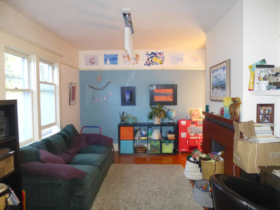 Kid friendly living room and former coal fireplace