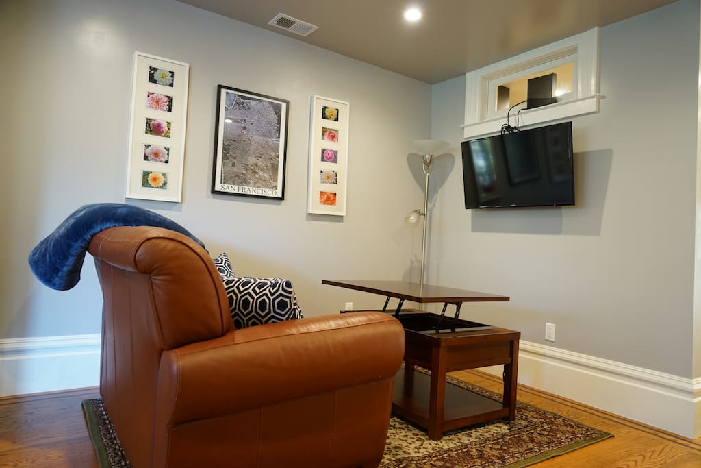 Living room with 32" TV. Coffee tabletop can be lifted up for working or eating